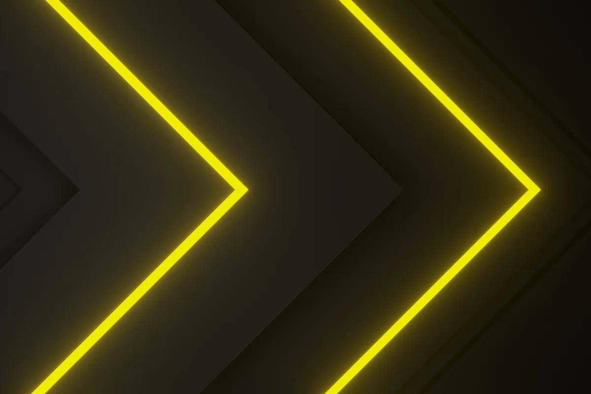 linhas luminosas de led amarelo formando setas em fundo escuro